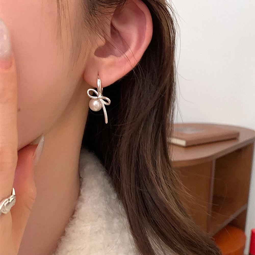 

Influencer Style Pearl Bow & Tassel Earrings - Versatile, Luxurious Design