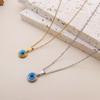 Squisito Set Collana e Orecchini in Acciaio di Titanio Placcato Oro con Design Occhio d'Angelo