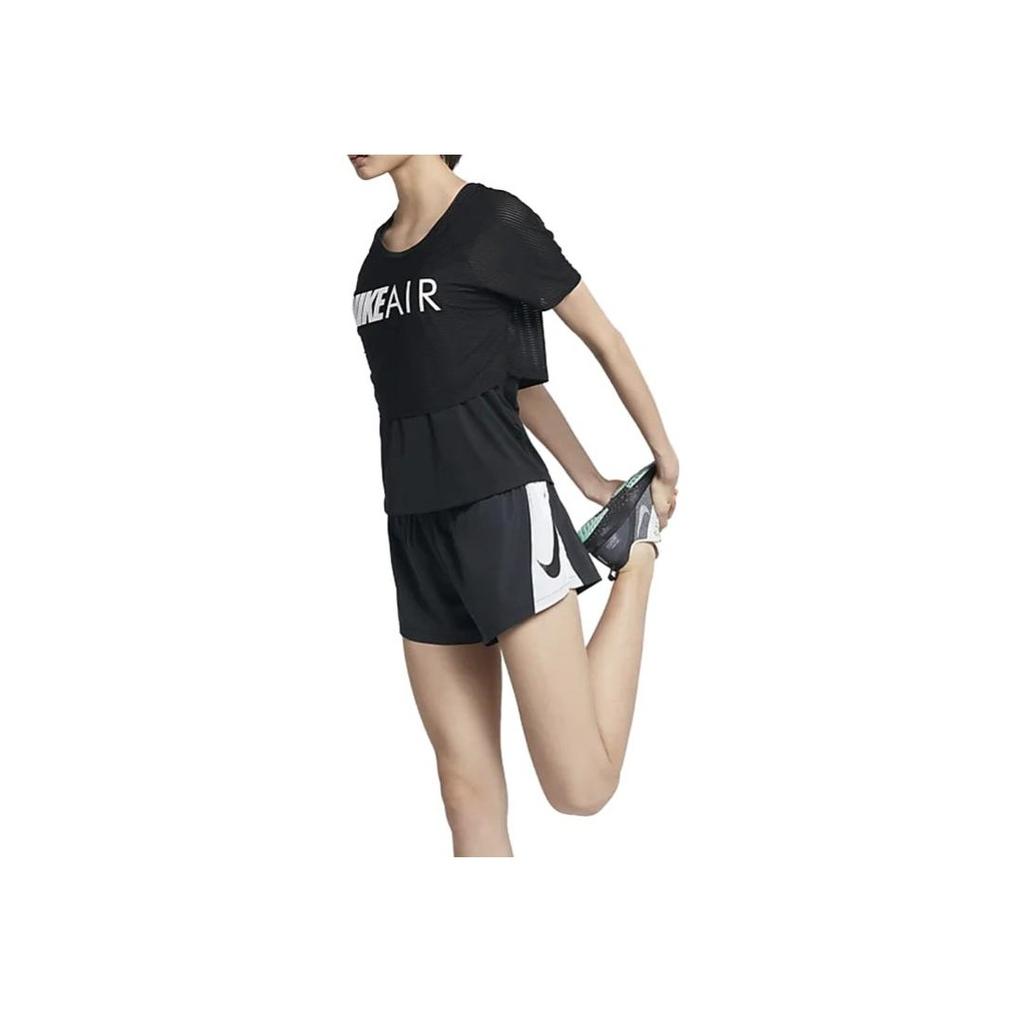 Nike Pantaloncini da donna a blocchi di colore con orlo diviso e vita elasticizzata Neri AT7965-010