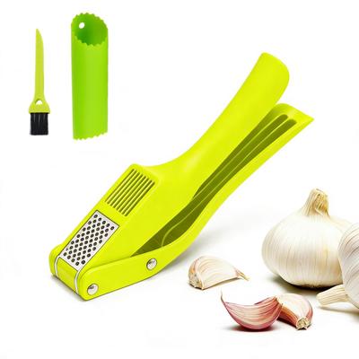 Kasanidika Garlic Press Stainless Steel Dual Function Garlic Crusher with Peeler and Brush Operation For Fine Mincing Garlic Home Kitchen Utensil