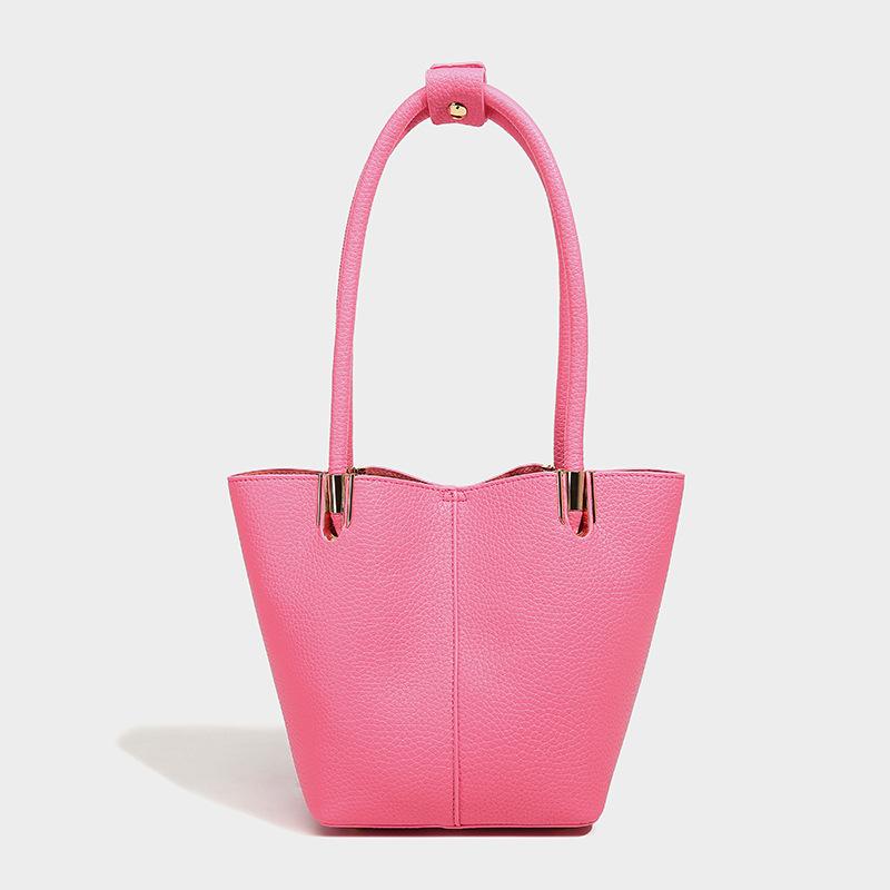 

Handheld bucket bag women s 2024 new French high-end texture commuter wind light fashion shoulder tote bag