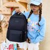 Schoolbag1011 new multi-color large-capacity load-reducing backpack, junior and high school student schoolbag, water-proof commuter computer backpack
