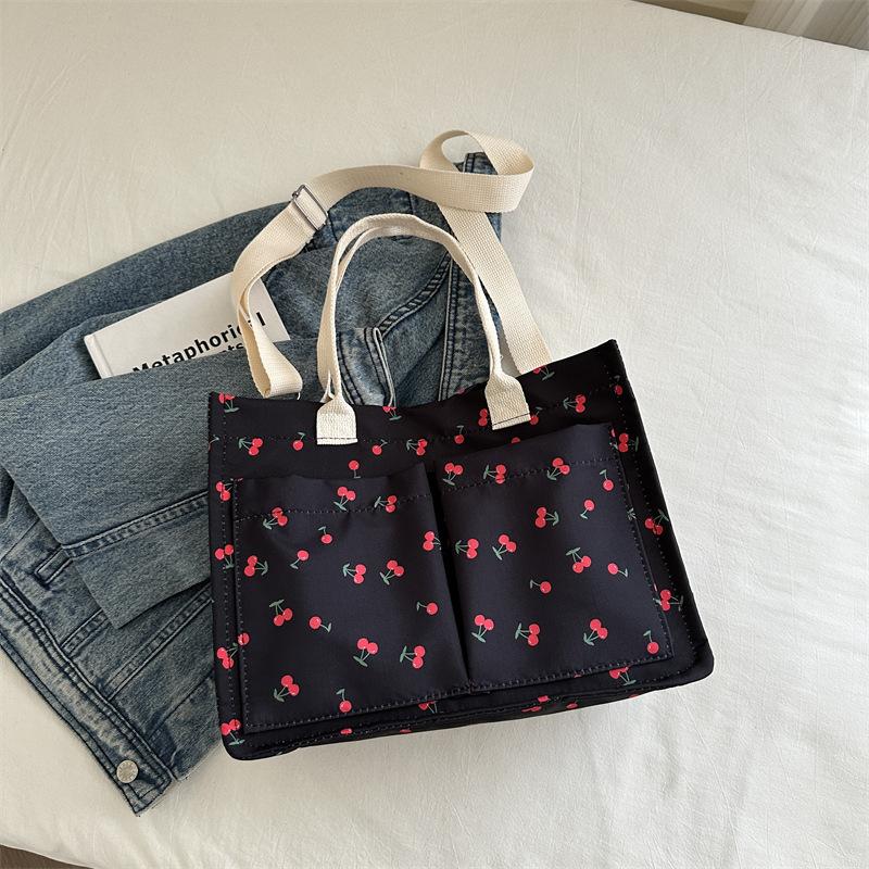 

Осень 2024 года, новая большая вместительная красивая простая портативная сумка-тоут, модная повседневная персонализированная сумка через плечо в студенческом стиле чёрный