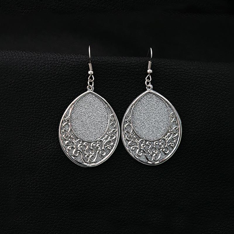 Frosted Geometric Leaf Tassel Earrings - Creative Hollow Round Design