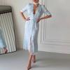 Nouveau de printemps, vêtements pour femmes européens et américains, robe à col en V tendance et élégante avec imprimé et empiècement en dentelle