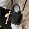 Korean version ins trendy personality contrasting colors casual hand carrying bucket bag fashion high sense versatile temperament messenger bag woman