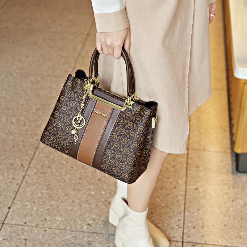 Atmosphärische und großvolumige Damen-Tragetasche Frühling High-End Nische Retro-Druck Einfache Handtasche mit einer Schulter Crossbody