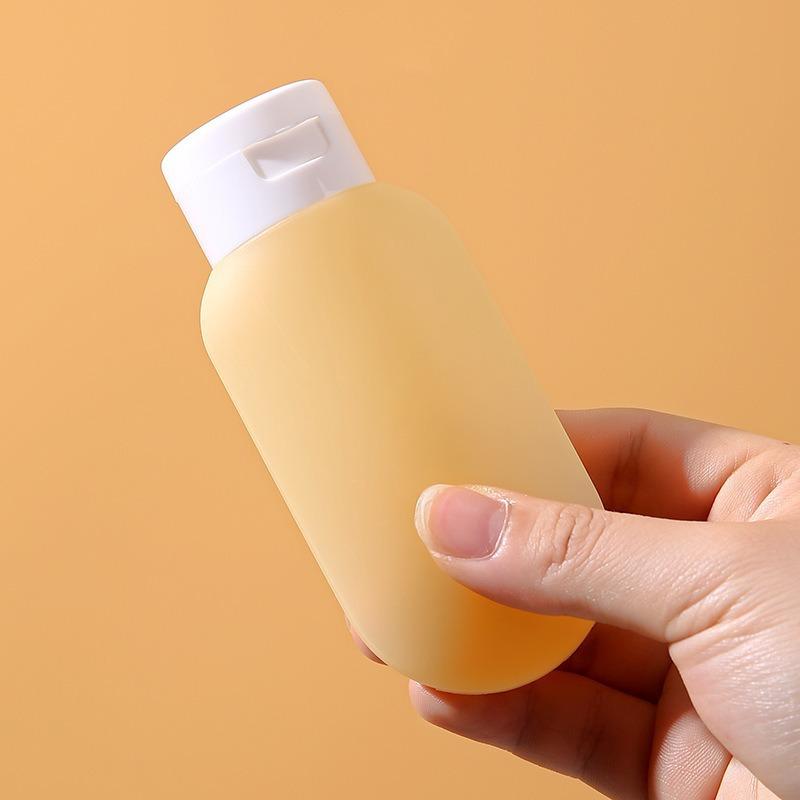 Reiseflaschen mit Shampoo, Duschgel, Reiseartikeln, Hautpflegeprodukten, Kosmetika, tragbaren Proben, leeren Flaschen