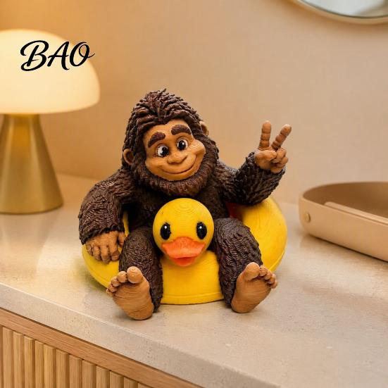 Miniature Sasquatch Figure And Duck Figurine, on Swimming Ring Statue, Playful Tabletop Accent Funny Animal Statue for Home Shelf Decor Creative