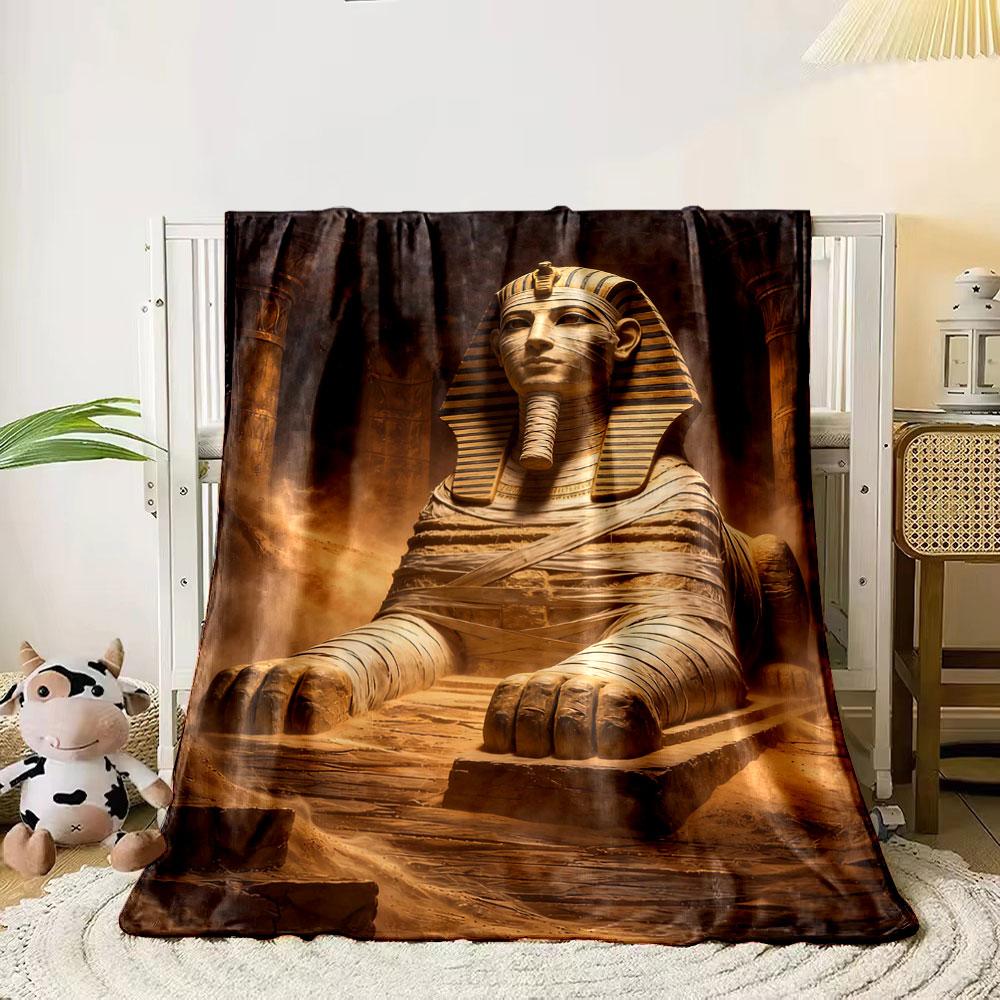 A statue of a sphinx wrapped in bandages, set in a dusty ancient scene. for all seasons blanket lunch break throw gift 80cm x 120cm