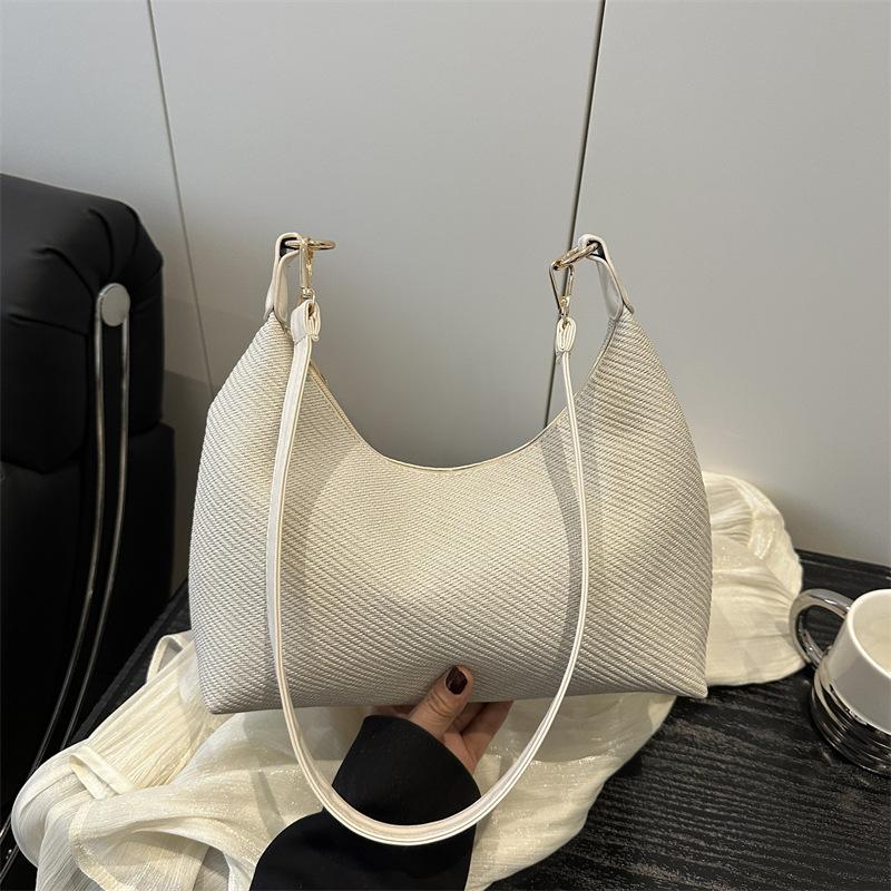 Knitted women's bags niche high-end new popular bags women's messenger bags commuter versatile shoulder armpit bags