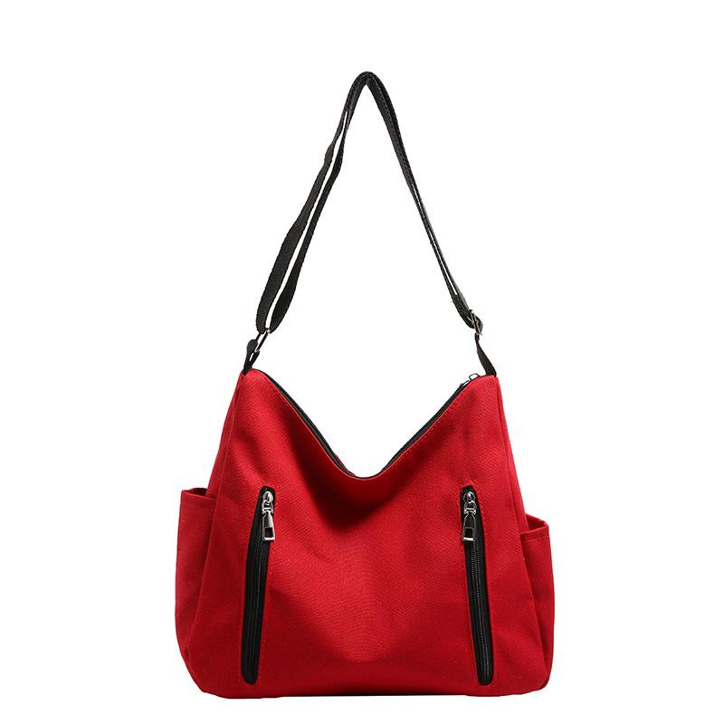 

Large capacity canvas bag women s 2025 new messenger bag niche class college student shoulder bag commuter tote bag червоний