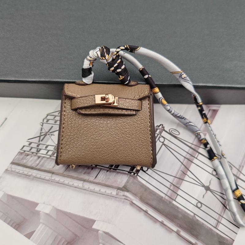 

Милый чехол для наушников в форме гоминида, можно повесить, высококачественная кожа, креативный кулон-брелок для ключей автомобиля 6.5x2.5x5cm темно-серого