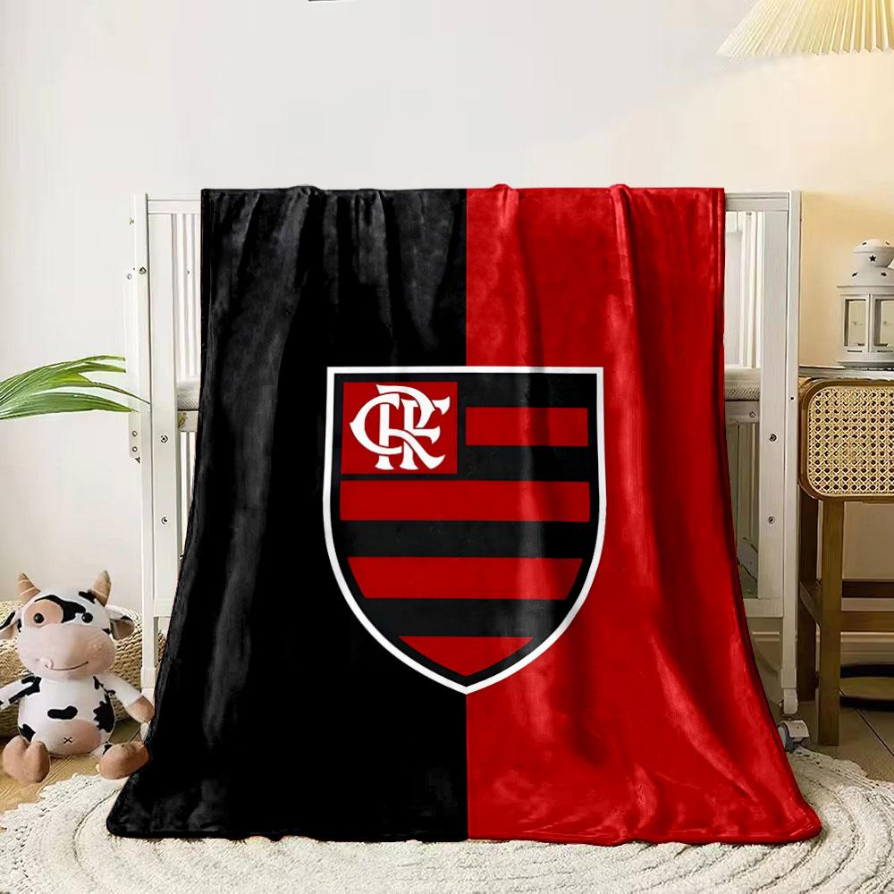 A vertically split black and red background with a striped shield emblem. for all seasons blanket lunch break throw gift