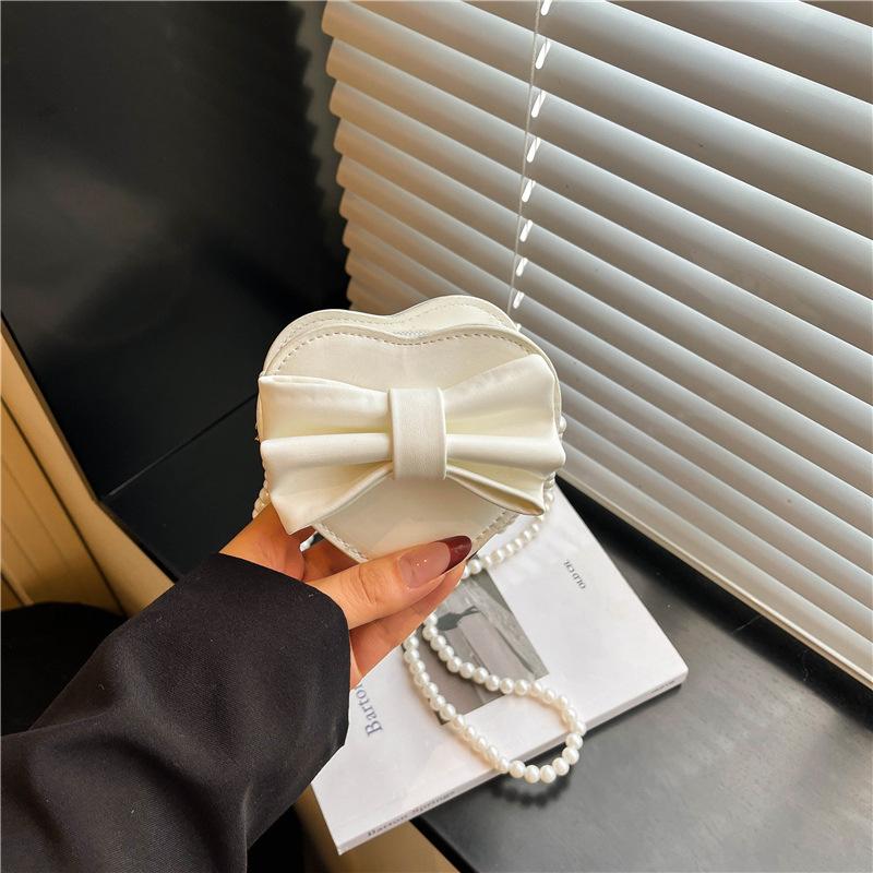 Summer new Korean version heart-shaped bow women's bag small bag foreign style shoulder bag solid color small bag messenger bag women