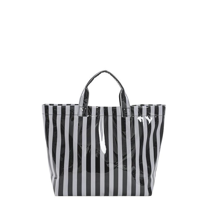 This Water-Resistant Pvc Tote Bag Features A Pink And Blue Striped Design, A Large Capacity, And Is Suitable For Beach Shopping,