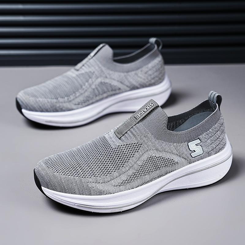 Flygande vävda sportskor med mjuk sula och andningsförmåga damskor 2025 höst nya utrikeshandel fritidsskor herrskor en pedal