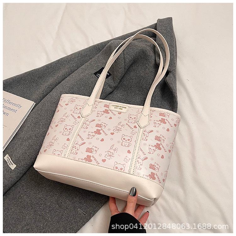 

Простая темпераментная сумка-тоут большой вместимости женская 2025 весна и лето новая маленькая свежая печать на плечо для поездок на работу сумка под мышку белый