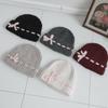Bonnet en laine Golji bicolore rose à revers pour femme