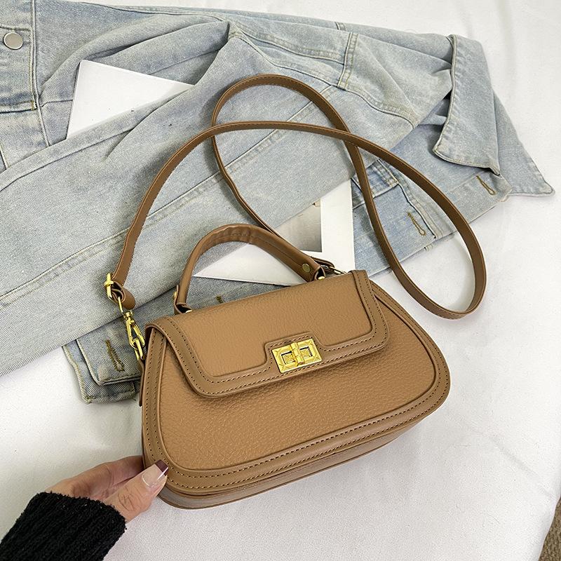 Spring niche design fashionable contrasting color saddle bag portable shoulder crossbody trendy women's bag
