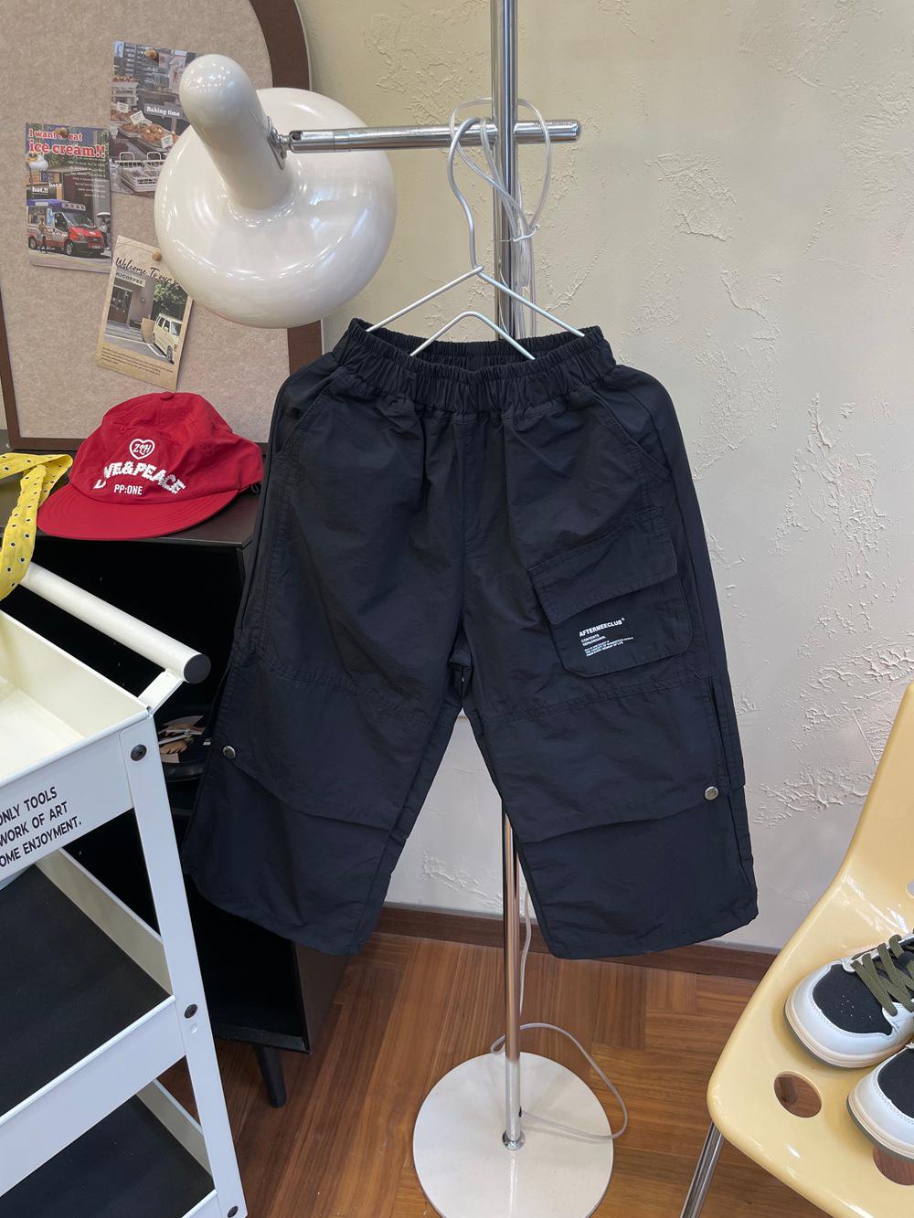 

Детские брюки 3D карманы, кнопки-заклепки, свободные прямые, имитация двух частей, с манжетами - Модная коллекция осень 2025 150 cm чёрный