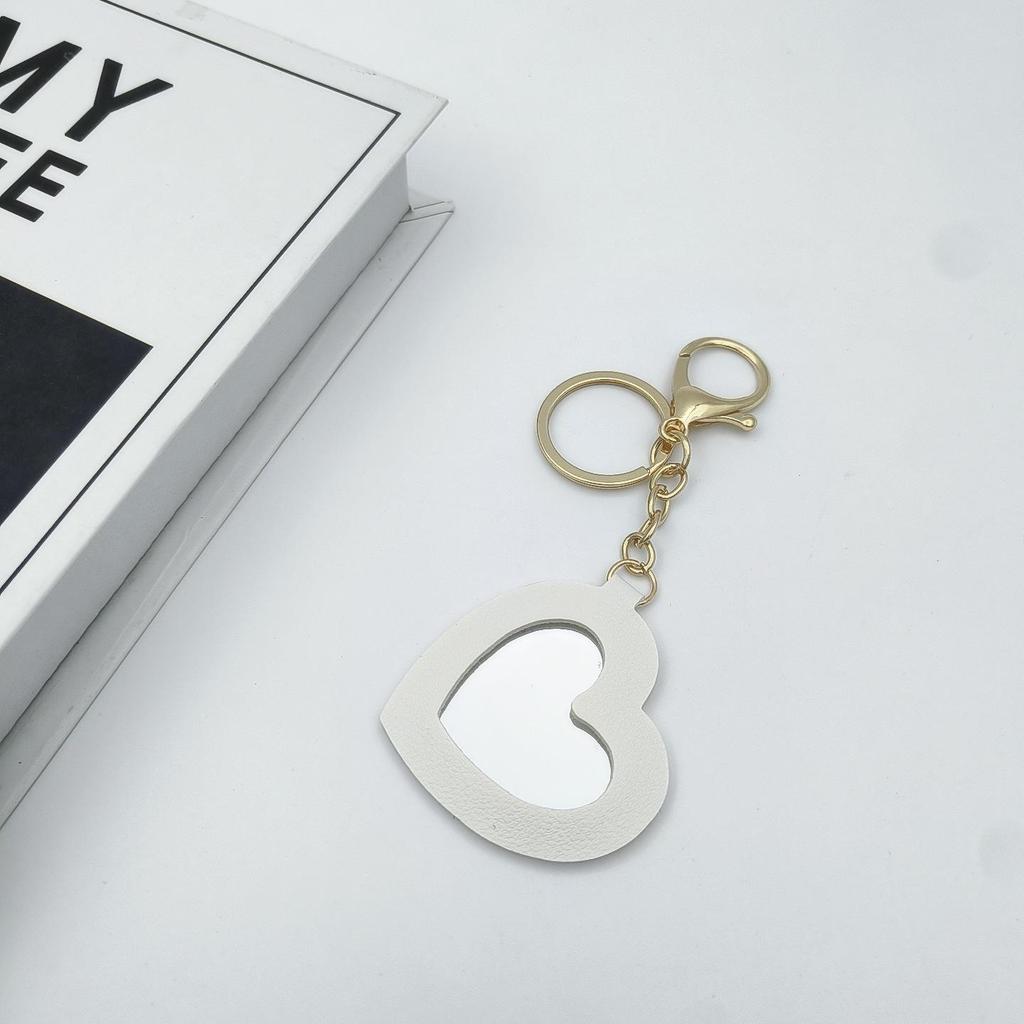 Přenosné pouzdro na rtěnku ve tvaru srdce s ochrannou kůží a roztomilou klíčenkou s přívěskem