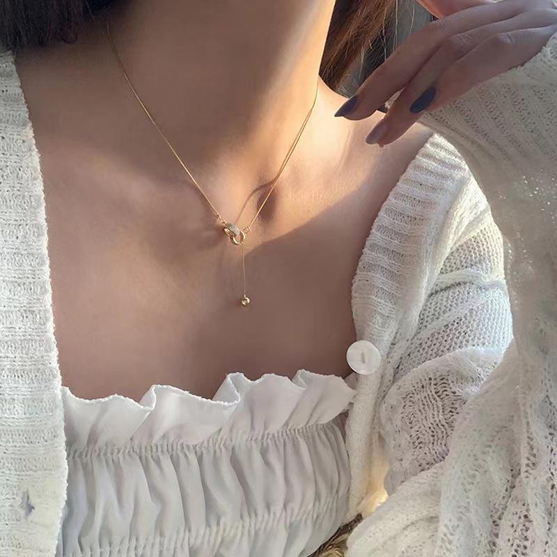 Women's Double Ring Zirconia Pendant Necklace with Gold Beads – Tassel Design, Light Luxury, High-End Clavicle Chain