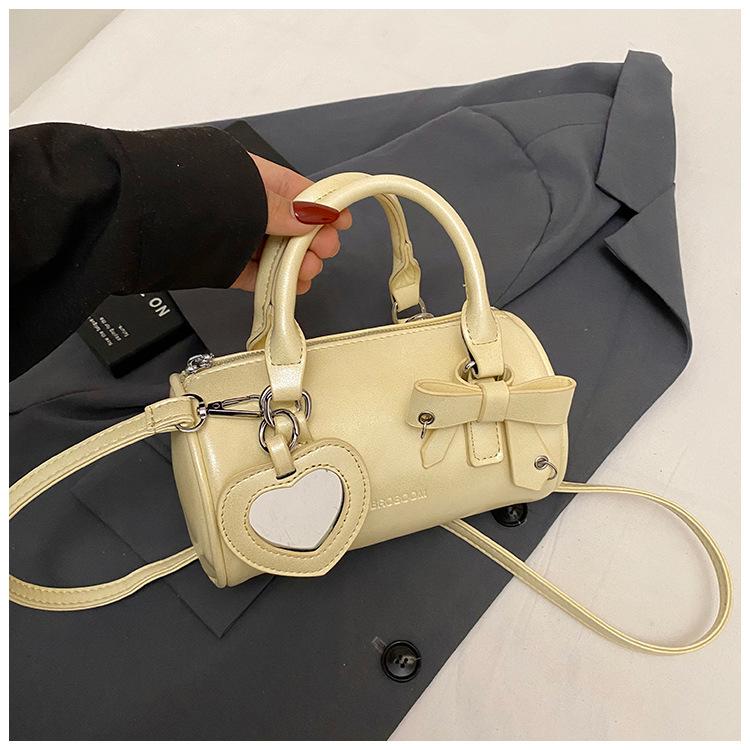 

Handheld cylinder bag women 2025 new trendy fashion bow pillow bag versatile shoulder messenger bag жёлтый