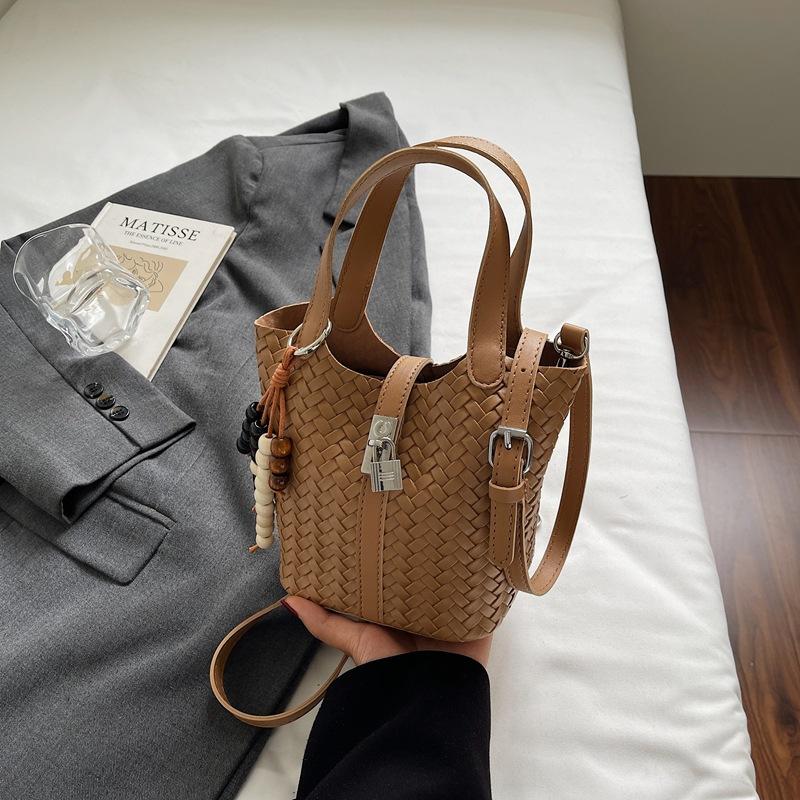 

2025 autumn new woven bucket bag single shoulder women s fashion portable messenger bag child and mother bag niche portable bag