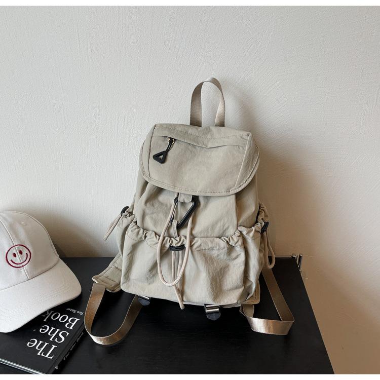 

Double shoulder schoolbag 2025 summer new cloth surface large capacity solid color drawstring backpacking high school students portable shoulder хакі