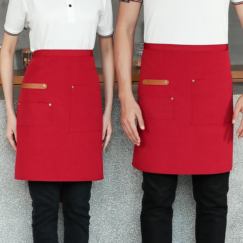 Unisex vanntett kjøkkenforkle i kanvas med halvlangt design og logo i midjen