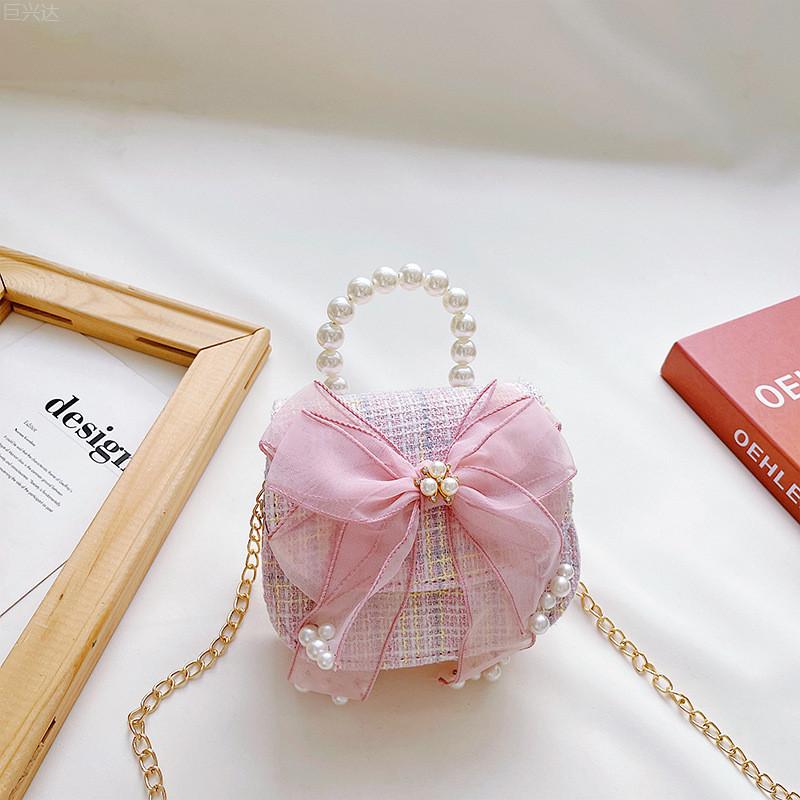 

Fashionable Kids Crossbody Bag With Fun Bow And Pearl Accents Perfect For Winter Use Light Pink