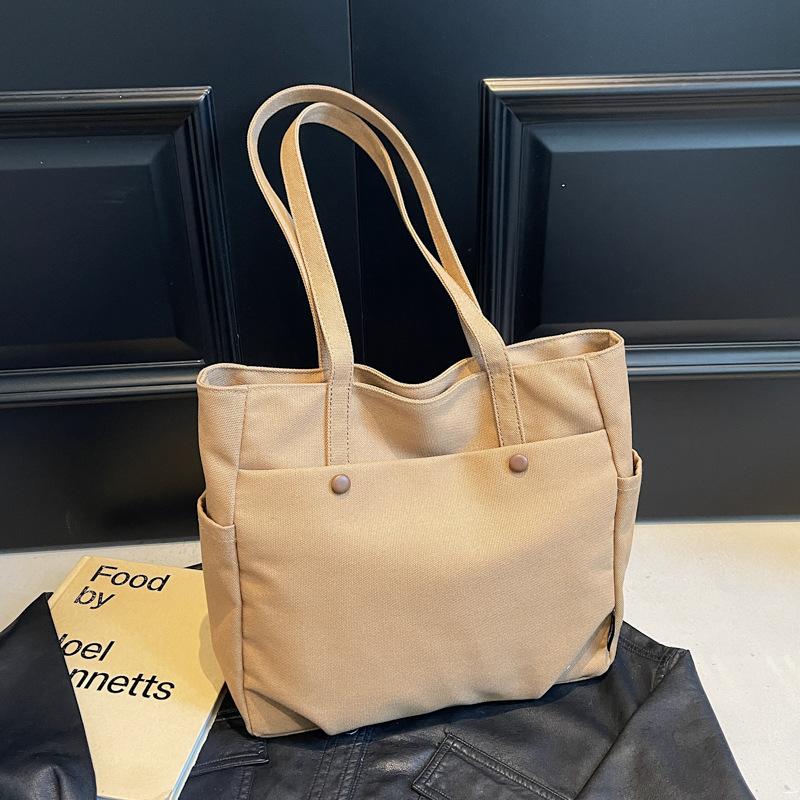 

Large-capacity canvas bag for women at work 2025 new versatile simple schoolbag fashionable portable tote bag чёрный