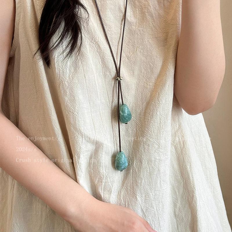 Irregular resin long necklace women's niche retro ethnic style wax rope sweater chain high-end sense item decoration