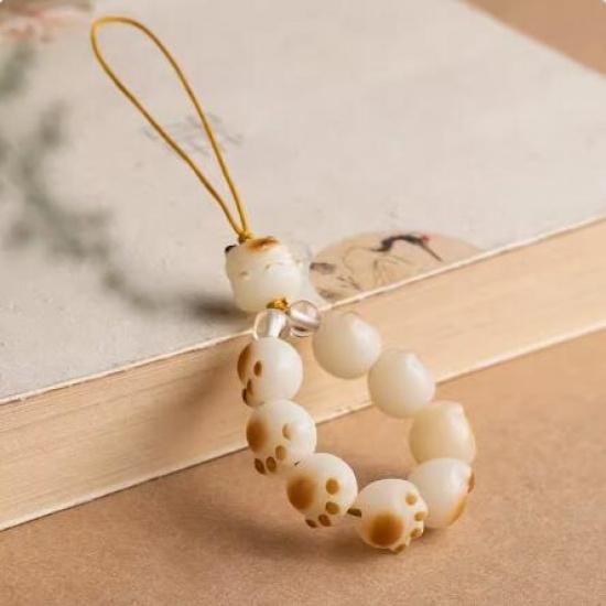 

Qiong Rui Charcoal-Burned Fortune Cat Paw Phone Strap Bodhi seed soft-touch ornament paired with car key chain Mobile phone chain model