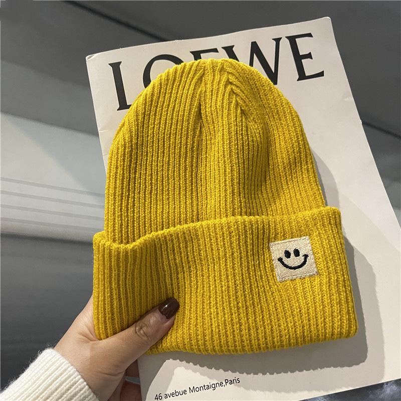 Autumn/Winter 2025 Smiley Face Woolen Knit Hat - Unisex, Warm, and Versatile Black with Ear Protection.