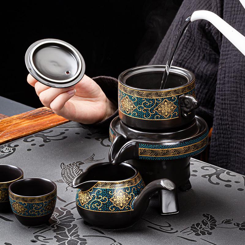 New Chinese lazy stone grinding semi-automatic tea set stone grinding ceramic retro gilt printing tea set small gift