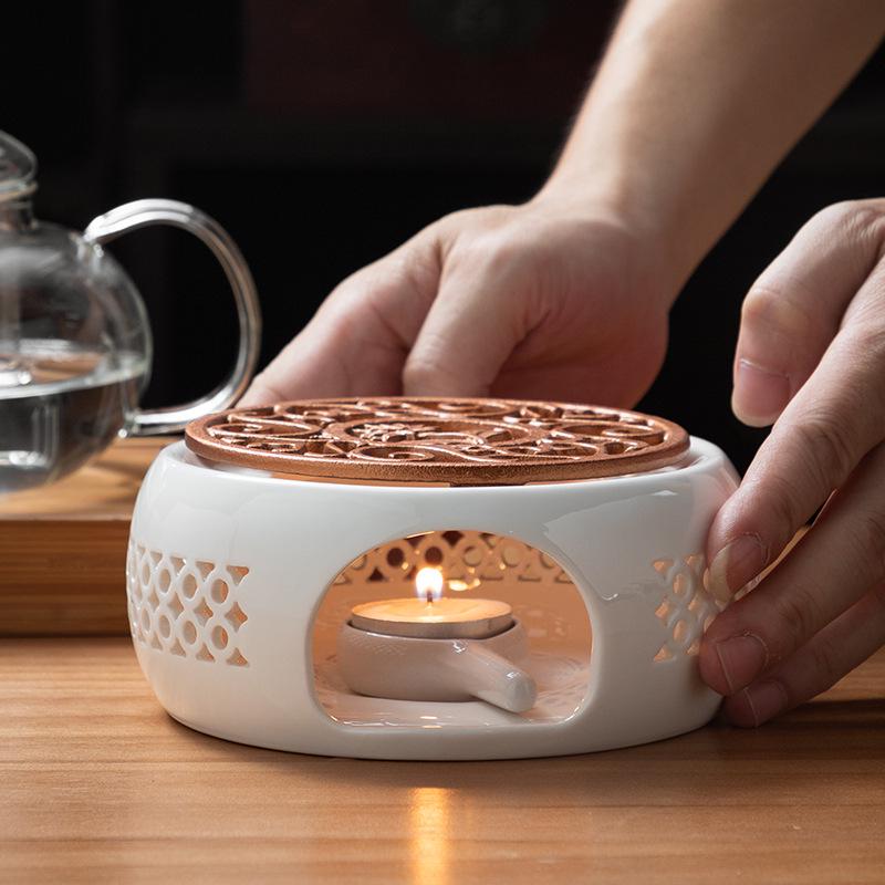 White Porcelain Tea Set with Black Ceramic Stove and Candle Base