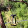 Solar Wrought Iron Lantern Light: Retro Mesh Pendant for Outdoor Garden, Courtyard, and Balcony Ambiance.