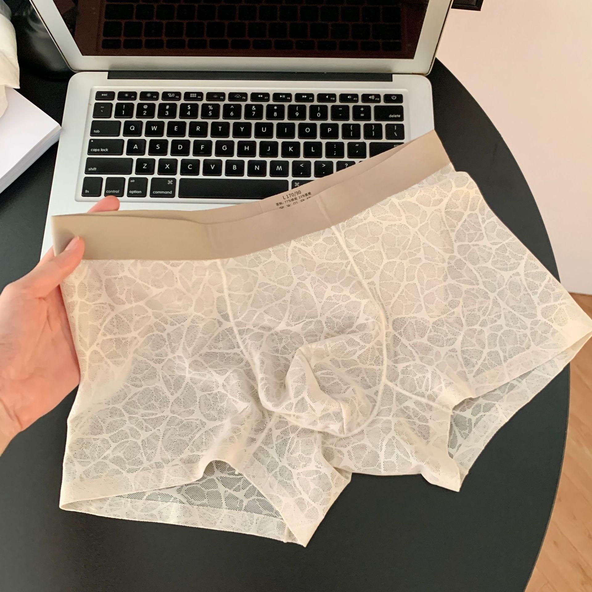 

Men s Spring and Summer Ice Silk No Trace Transparent 10A Antibacterial Mid Waist Flat Angle Underwear 3XL абрикосовий/бежевий