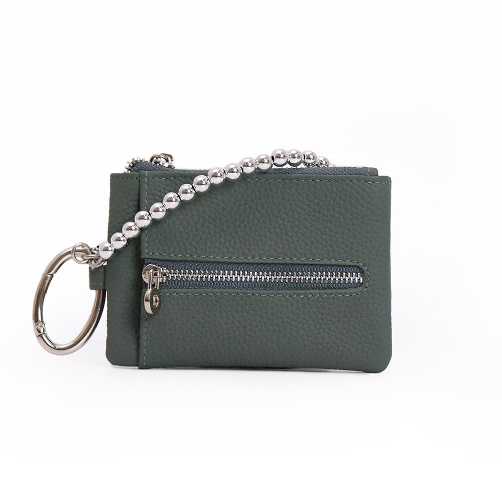 

The new pendant key bag is compact, and the change bag is multi-functional. The key bag is integrated with a storage bag for women.