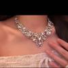 Luxury Rhinestone Teardrop Jewelry Set: Oval Earrings & Clavicle Necklace for Women.