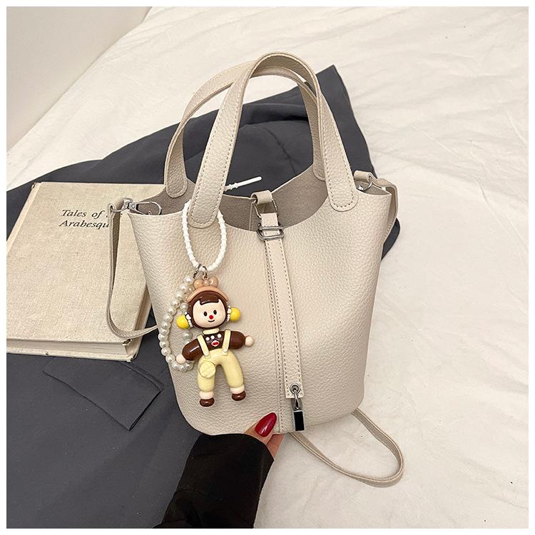 Beliebte tragbare Eimertasche Damen Frühling und Sommer 2025 Neue einfache und lässige Umhängetasche Modische Umhängetasche