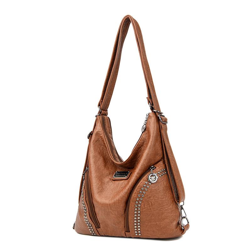 Retro soft leather locomotive bag New trendy rivet oblique span shoulder bag Spot quality women's bag