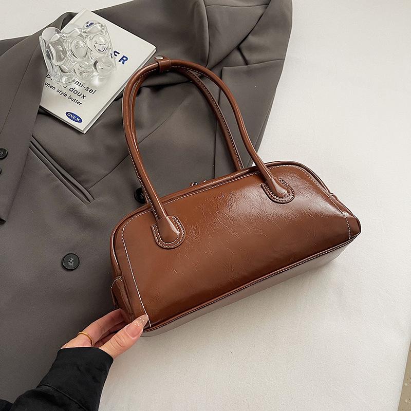 

Американская ретро универсальная сумка-багет под мышкой женская осенне-зимняя продвинутая текстура легкая роскошь нишевая портативная на плечо