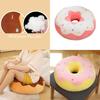 Almofada de pelúcia em formato de donut, fofa e ideal para decoração de casa e assento confortável.