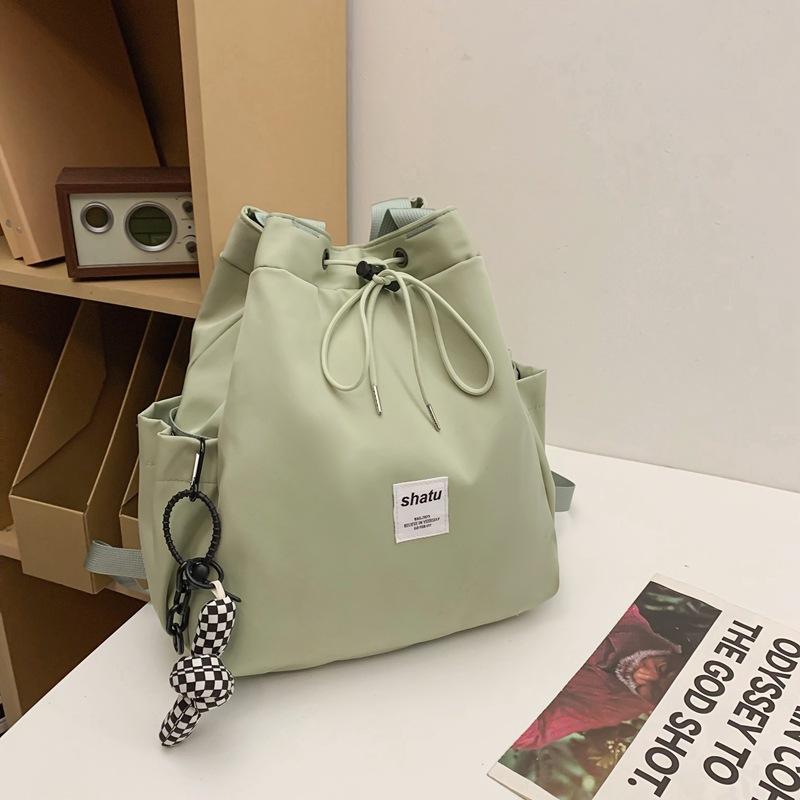 New dual-purpose small backpack, casual niche girlfriend handheld shoulder bag, Japanese and Korean drawstring commuter work backpack