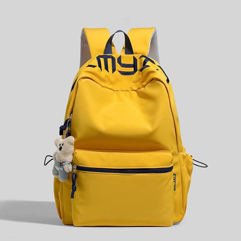 Schoolbag Japanese simple and versatile large-capacity solid color campus schoolbag 1011 summer new light commuter student backpack