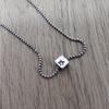 Used moschino silver necklace square dice
