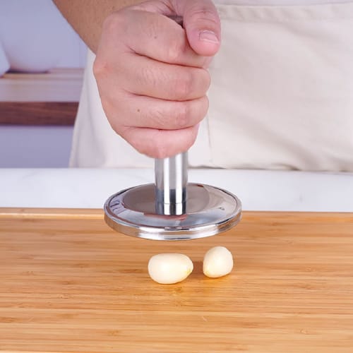 Dishwasher-safe meat tenderizer for tenderizing garlic, walnuts, and other meats. Flat, smooth, and lightweight, with a compact, ergonomic handle.